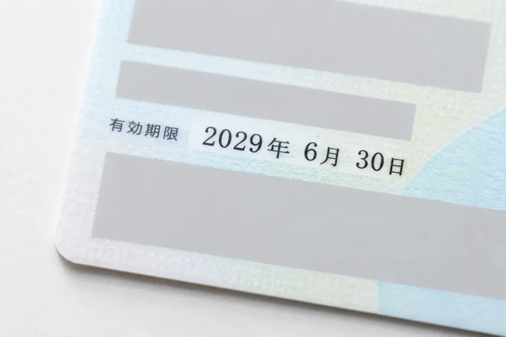Residence-card date fields printed in four-digit Western-year format, with all identifying details obscured
